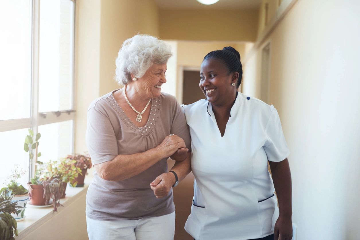 a nurse holding a senior woman